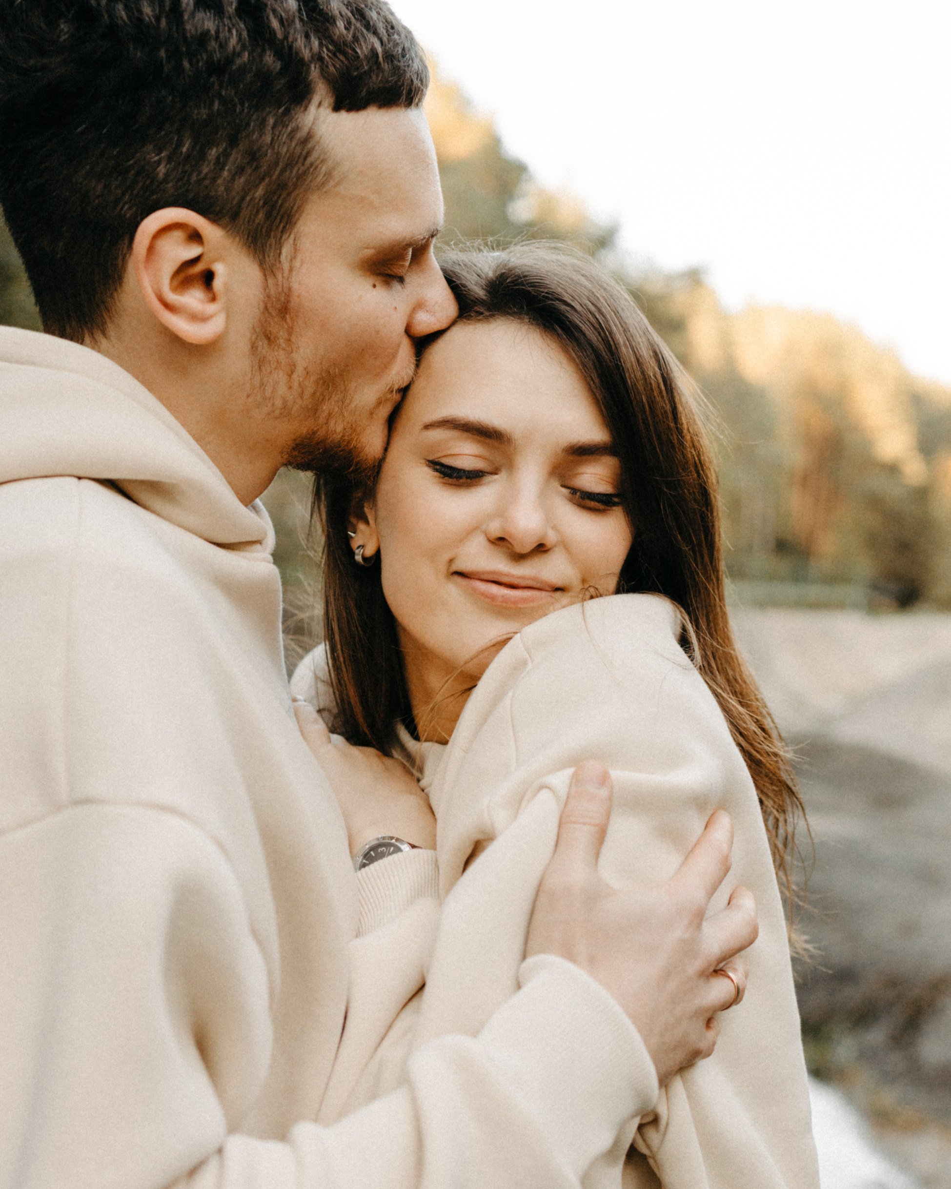 Happy Couple Wearing Beige Hoodie