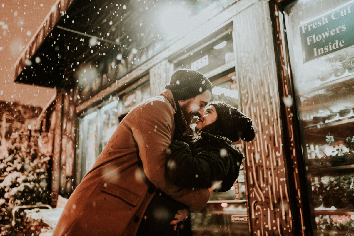 Couple Kissing on a Snowy Winter Night