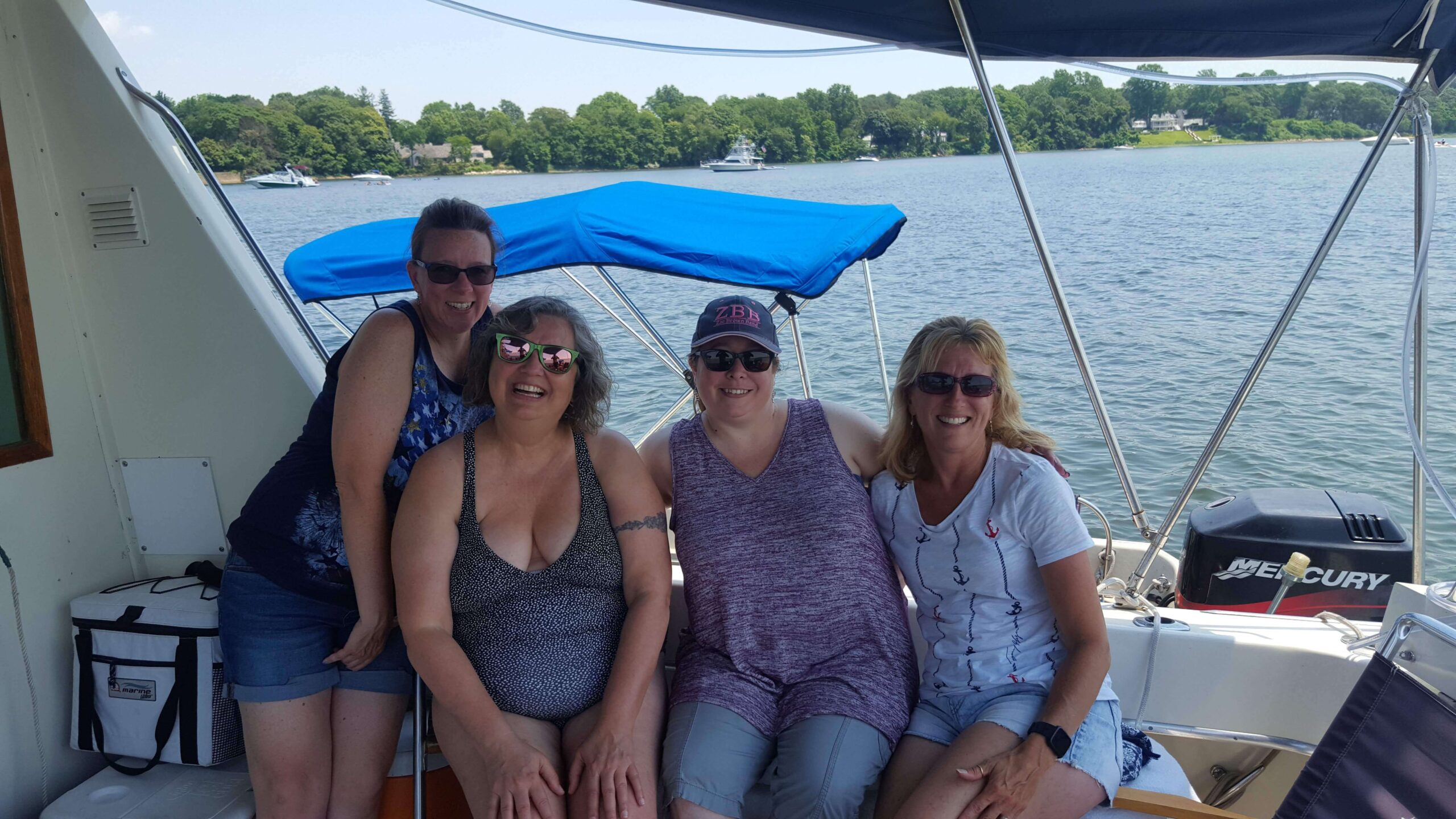 Tracy and sister in laws hanging on the boat